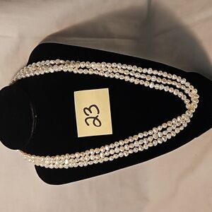 23. Triple strand baroque freshwater pearl necklace